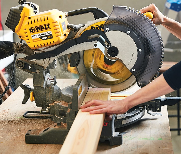 Person using a mitre saw