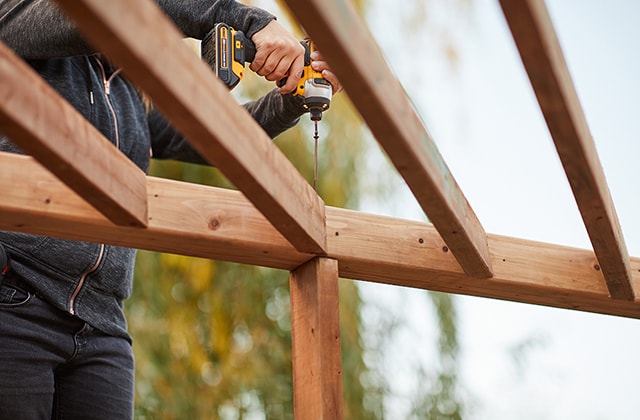 Person installing a wood slat support