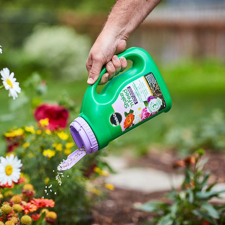 Person pouring fertilizer