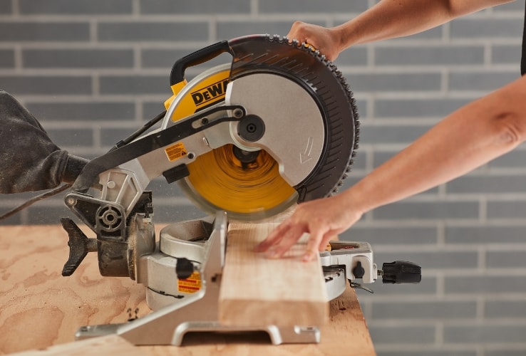 Person using a mitre saw