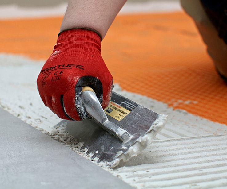 Person creating mortar ridges