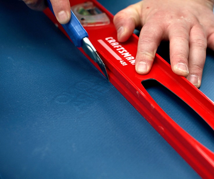 Person using a utility knife