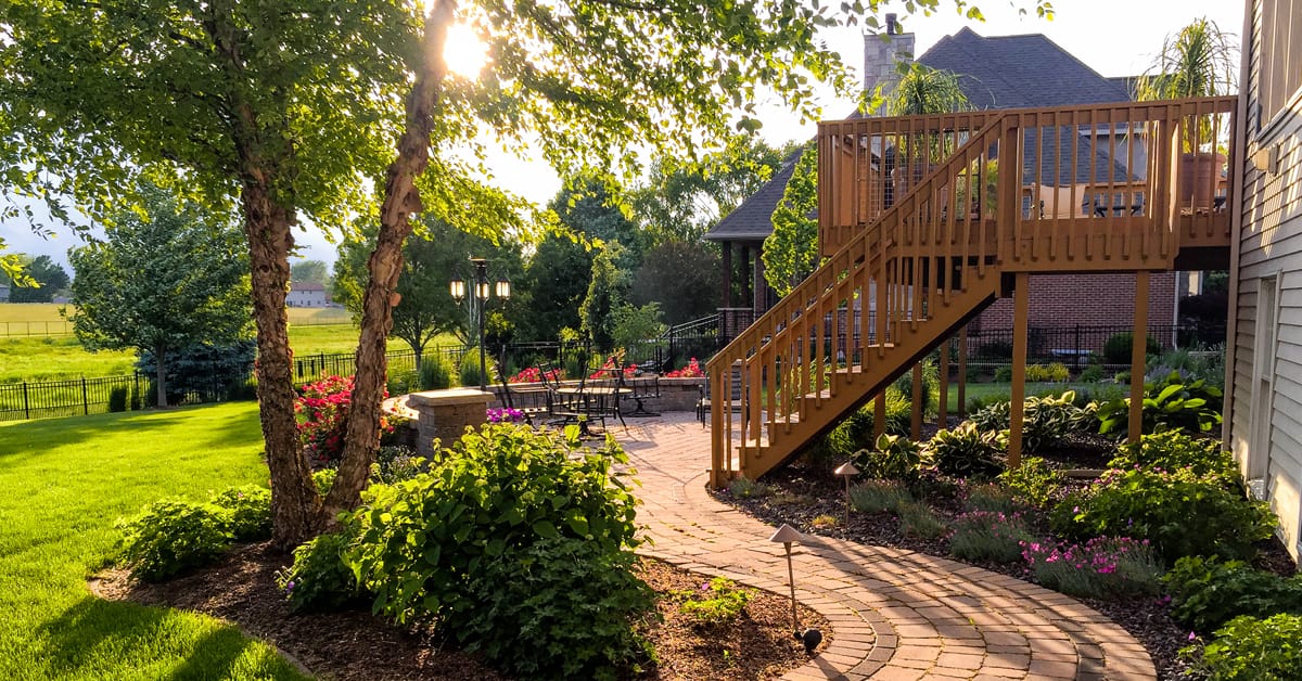 Create a paved area with concrete pavers or slabs