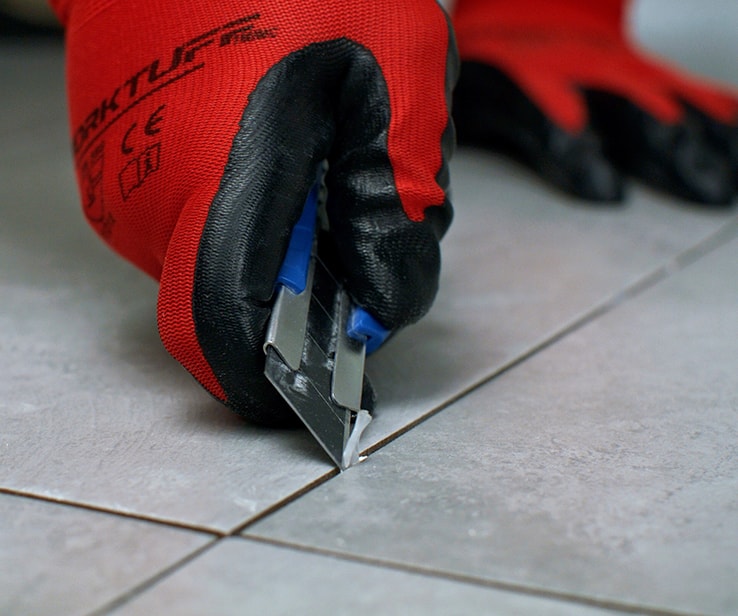 Person using a utility knife