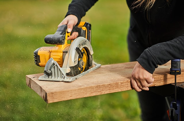 Person using a circular saw