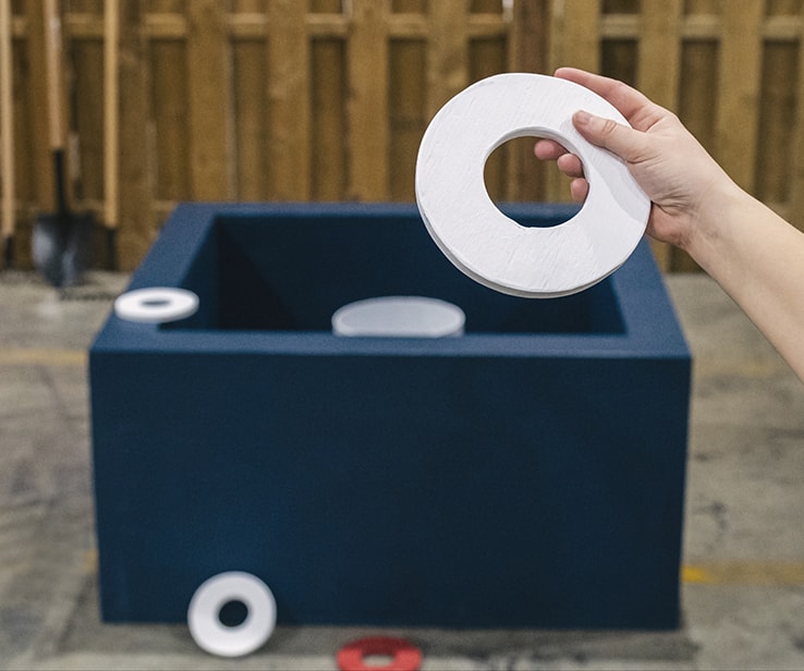 Person playing washer toss