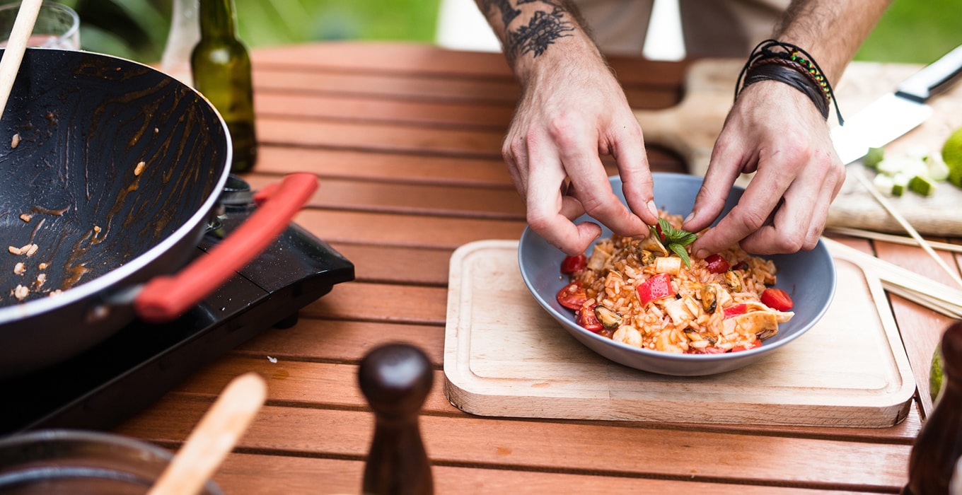 Man preparing food outside