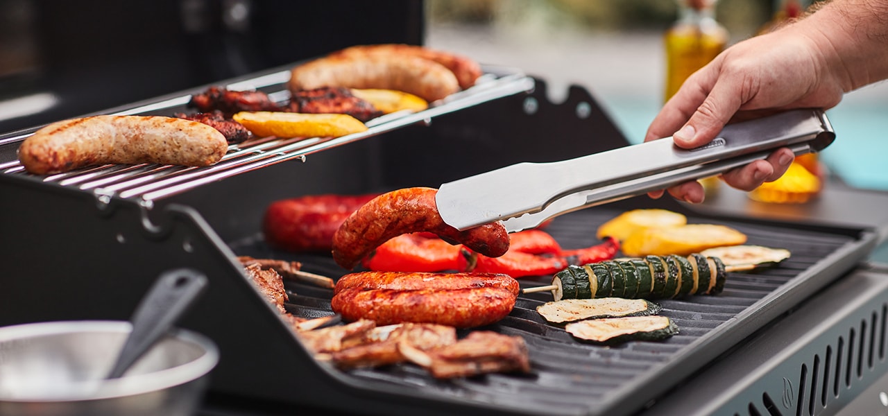 A person cooking on a barbecue