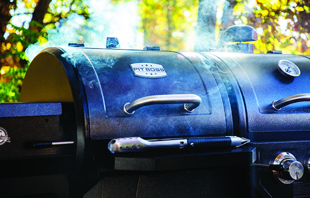 Smoker barbecue in a backyard