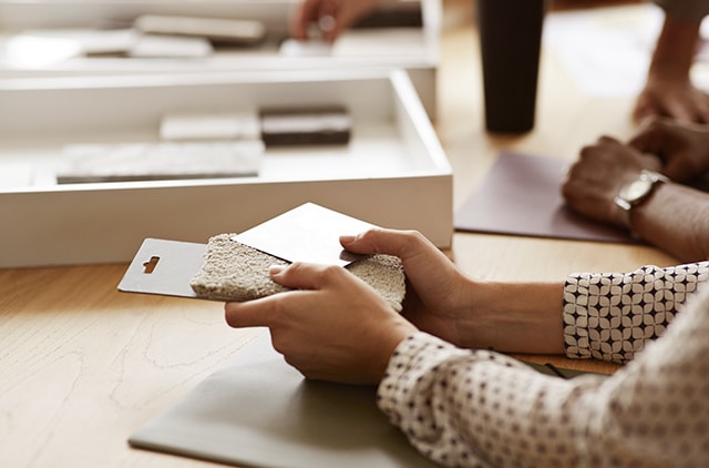 Woman touching material samples