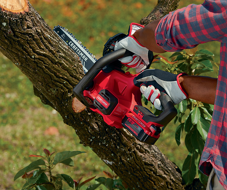 Man using a Craftsman chainsaw