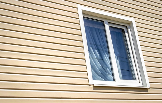 House with beige vinyl siding