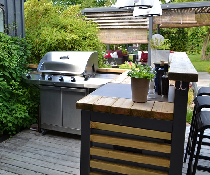 Outdoor kitchen right next to a house