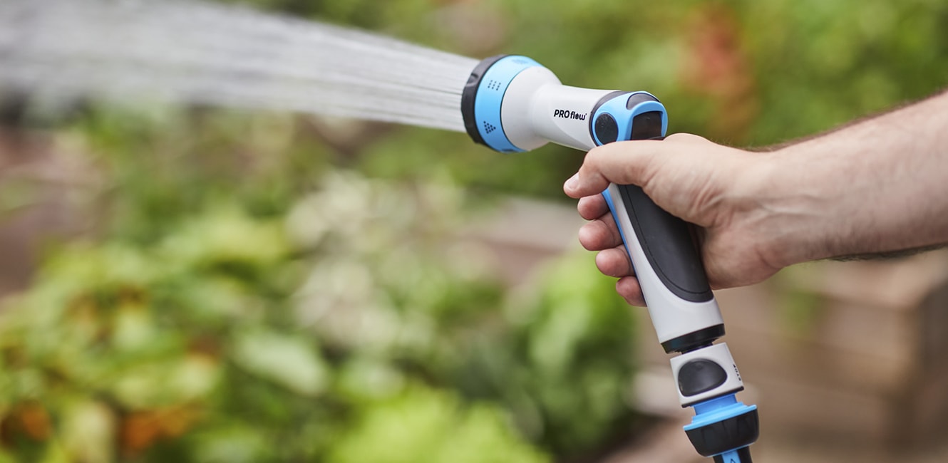 Person watering a garden