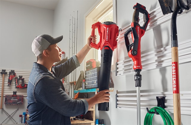 Man storing power equipment