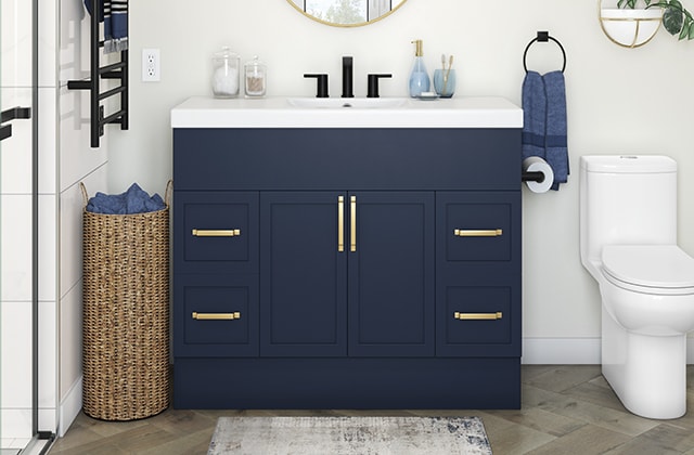 Navy blue bathroom vanity with brass hardware